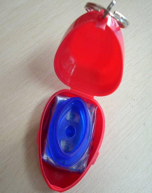 Heartshape plastic box with CPR face shield image